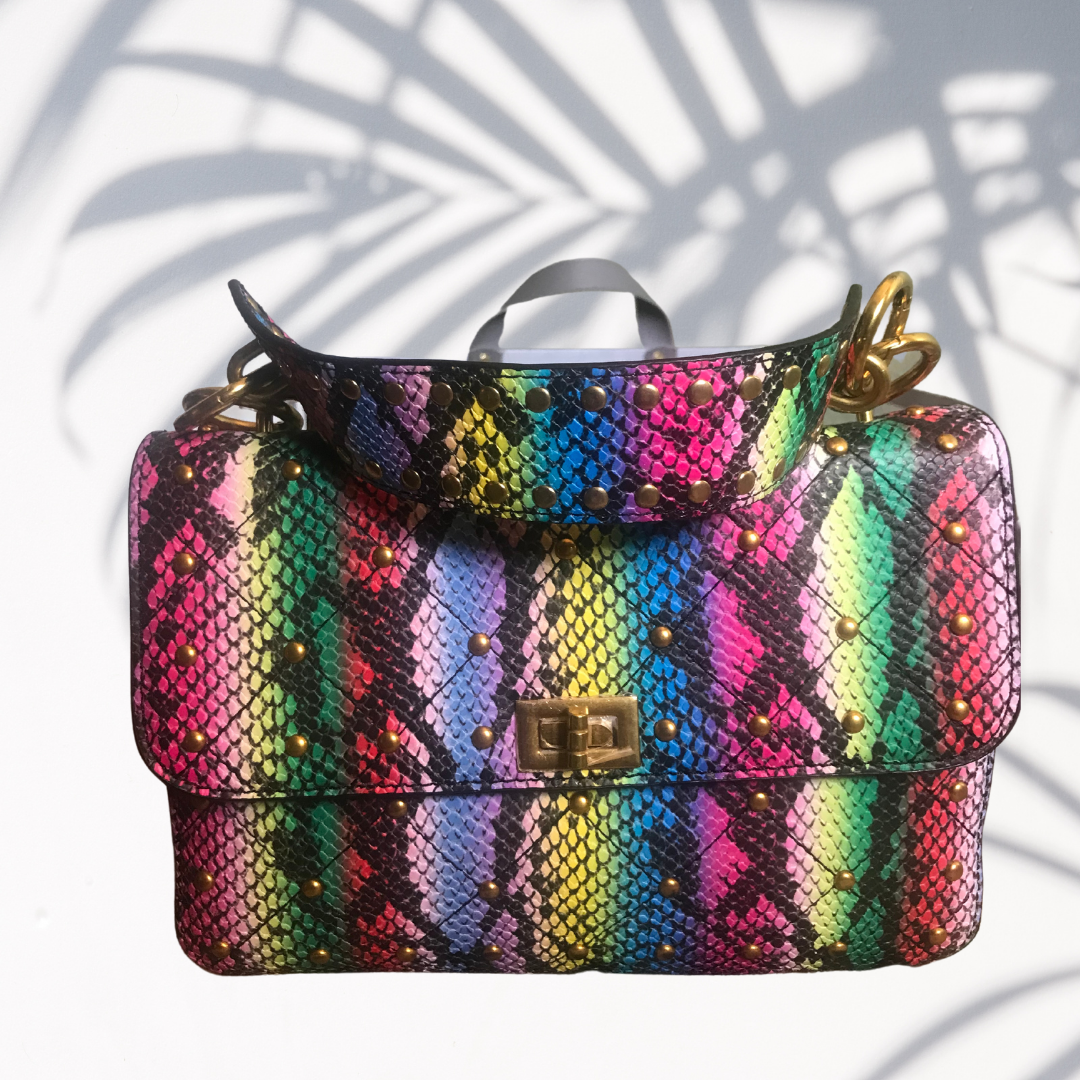 Pink/multi color snake print hand bag. Can also be worn as cross body