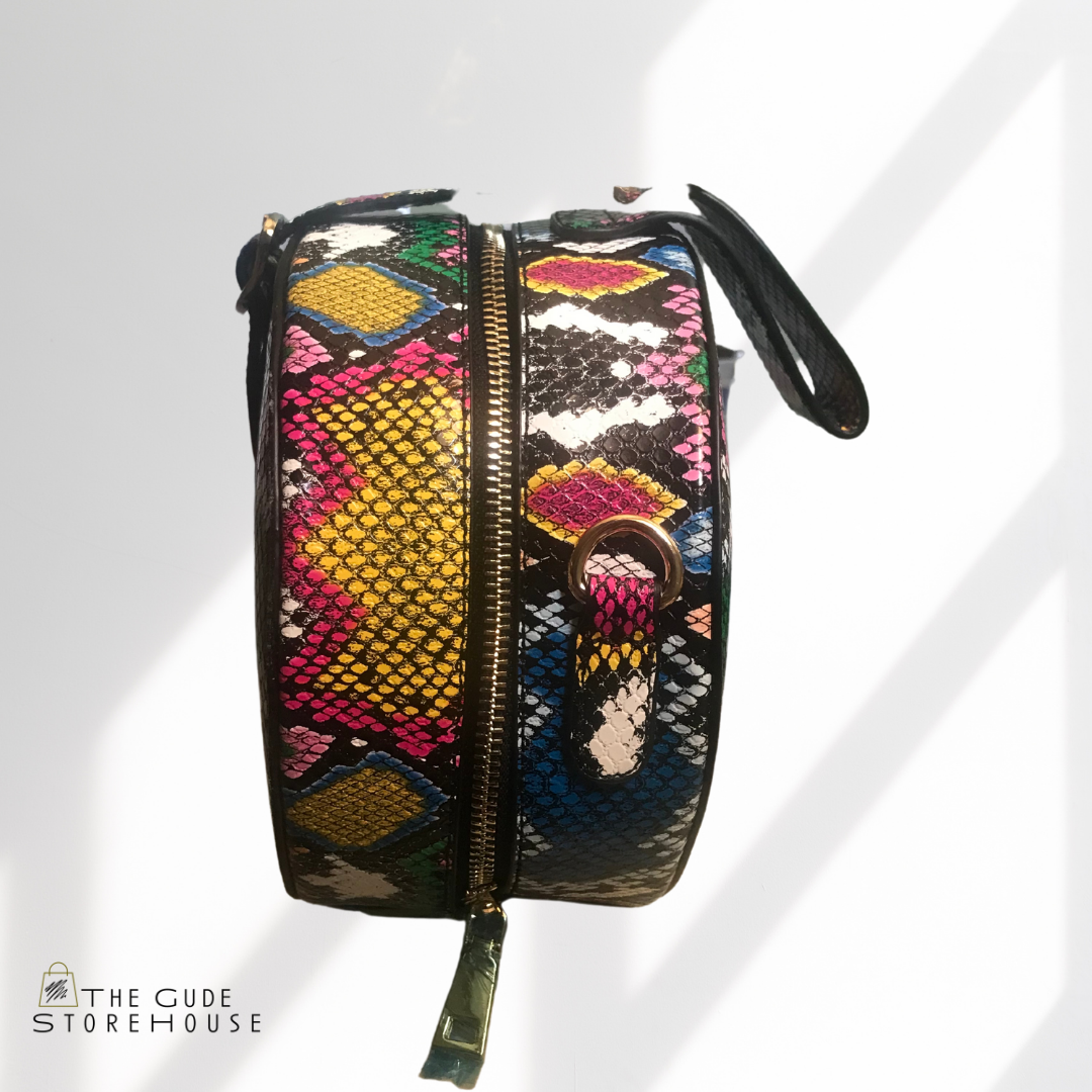 Blue snake print handbag with removable strap. Can be worn as a handbag or crossbody.