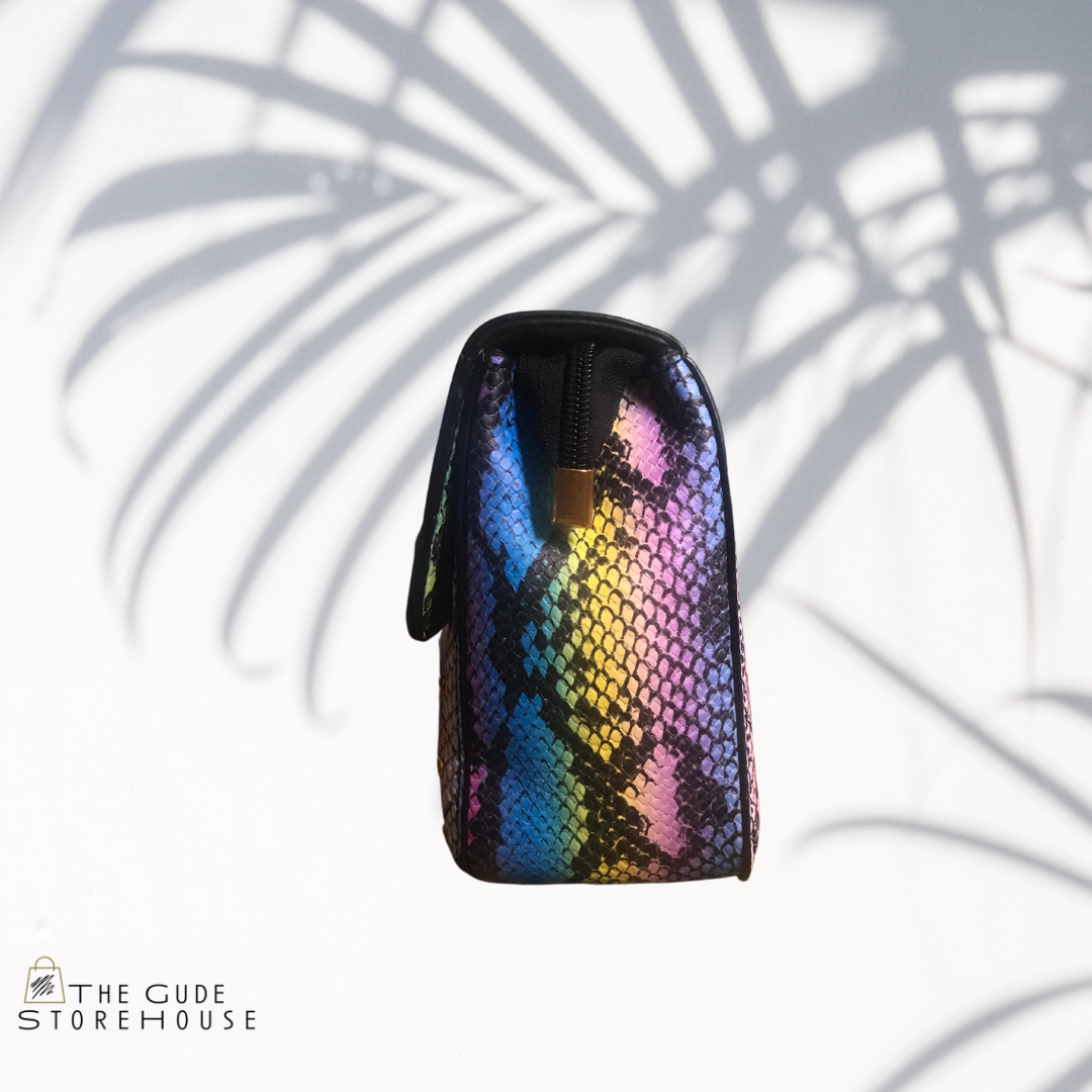Pink/multi color snake print hand bag. Can also be worn as cross body