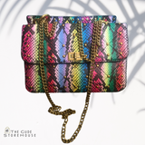 Pink/multi color snake print hand bag. Can also be worn as cross body