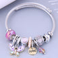 This bangle is BEAUTIFUL and full of charm! Hypoallergenic and skin friendly. Adorned with lovely lavender stones, pearls and crystals. This bracelet is stretchy and comfortable to wear. Great for everyday wear. This piece a great gift.  **If gifting this to a friend or loved one, add that on the notes at check out. This item will be gift wrapped in a gift box at no charge!