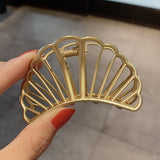 Looking for something new to up your hair game? Our medium shell hair clip with a sleek, vintage design is perfect for you. There's no need to worry about breaking your nails, because the claw clasp is gentle on your hair and slides in easily. With our shell hair clip, it's easy to start a trend with the most up-to-date accessory.